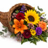 Wicker cornucopia filled with colorful mixed flowers