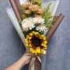 Handheld bouquet with a sunflower, white chrysanthemums, and peach blooms