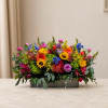 Colorful mixed flower arrangement in a rectangular wooden box