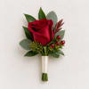 Single red rose boutonniere with greenery and berries