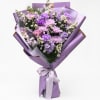 Lavender bouquet of mixed purple flowers wrapped in purple paper