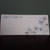 Floral gift certificate with blue and white flowers