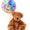 Teddy bear with a colorful Happy Birthday balloon