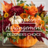 Pumpkin centerpiece with orange roses and burgundy mums