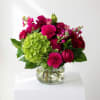 Pink and red mixed bouquet in a clear glass vase