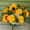 Bouquet of yellow roses and sunflowers in a vase