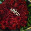 Bouquet of red roses with a jeweled tiara on top