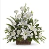 White lilies and carnations in a wicker basket