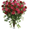 Bouquet of pink and red roses in a clear glass vase
