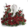 Red rose arrangement with an angel statue centerpiece