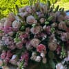 Large bouquet of pale pink roses and lilies with pink filler flowers