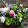Lush, lovely and abundant blooms effortlessly mix in this luxury garden basket.