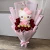 Bouquet of red roses with a Hello Kitty plush and gold chocolates in pink wrap