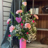 Pink carnations and baby's breath in a pink heart vase