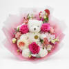 Pink rose bouquet with a white teddy bear in pink wrapping