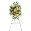 Standing floral spray with white and yellow flowers on an easel