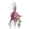 Tall floral standing spray with red and pink flowers on an easel