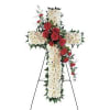 Standing floral cross with white and red flowers on an easel
