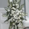 Tall white floral standing spray with lilies and daisies