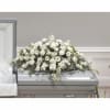 White floral casket spray with daisies and carnations
