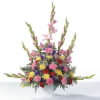 Colorful mixed flower arrangement in a white vase