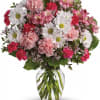 Pink and white mixed bouquet in a clear glass vase