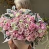 Large bouquet of pink and white roses with ruffled pink flowers