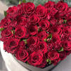 Heart-shaped box filled with red roses