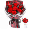 Bouquet of red roses wrapped in black and white paper with a ribbon