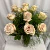 Bouquet of pale blush roses in a clear glass vase