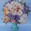 An arrangement filled with roses, dahlias, garden roses, lisianthus, peonies, hydrangeas, phalaenopsis