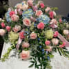 Large pastel floral spray with pink roses and blue hydrangeas