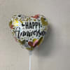 Heart-shaped balloon with "Happy Anniversary" text