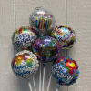 Cluster of birthday balloons with colorful printed designs