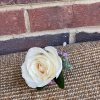 Single cream rose boutonniere with small purple accents