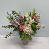 Mixed bouquet with pink roses, lilies, hydrangea, and green mums in a vase