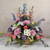 Soft, garden-fresh colors and a gentle, arching silhouette make this flower arrangement