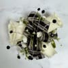 Petite cream-white spray roses contrasted with black and silver shimmering ribbon make
