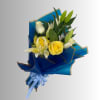 Bouquet of yellow roses and white lilies wrapped in blue paper