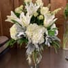 Beautiful assortment of spring favorites. Hydrangeas, Roses , Lillies and exotic greens