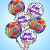 Cluster of colorful happy anniversary balloons on strings