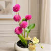 An elegant, modern, and vibrant floral arrangement designed in a white ceramic-style