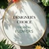 Round sign reading "Designer's Choice Tropical Flowers" with tropical flowers around it