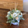 Stunning mix of ivory and white blooms, eloquently designed in a ceramic