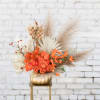 Stunning Autumn mix of orange roses, seasonal blooms and textures for the