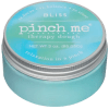 A turquoise tin labeled "pinch me" therapy dough