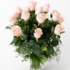 Bouquet of pale pink roses in a clear glass vase