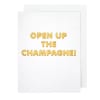 White card with gold text reading "OPEN UP THE CHAMPAGNE!"