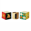 Three boxed candles, including a gold tin candle in the center