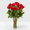 Bouquet of red roses in a clear glass vase